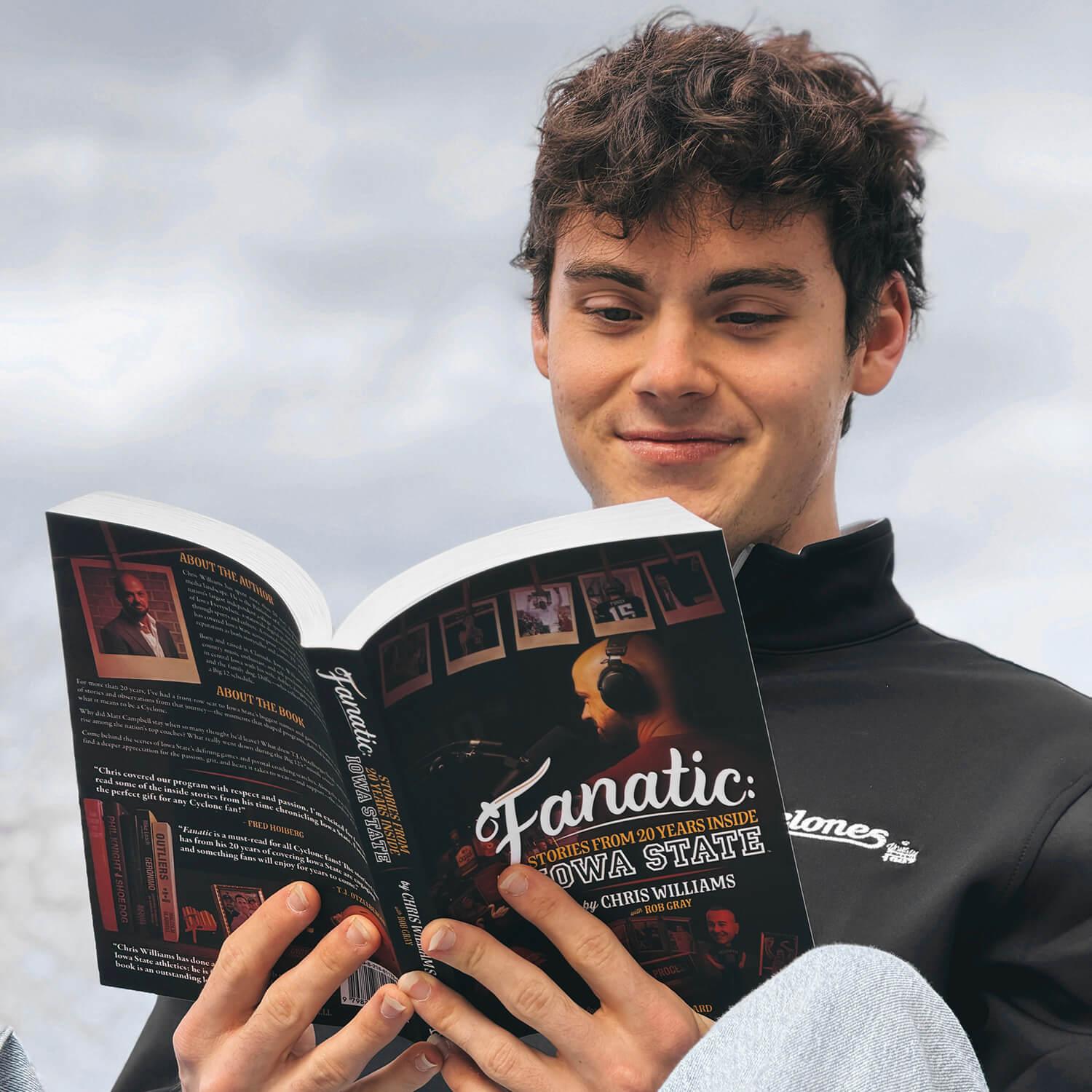 Cyclone fan reading the Fanatic: Stories from 20 years inside Iowa State book